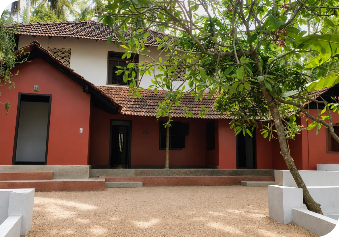 Traditional Kerala-style Ayurdehi house surrounded by greenery